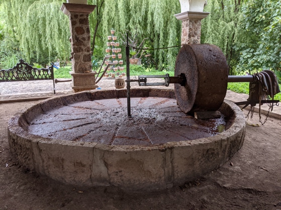 A tahona, a giant stone wheel used to crush cooked agave